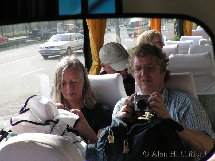 Margaret and Alan reflected in the mirror in the coach in Xi&rsquo;an